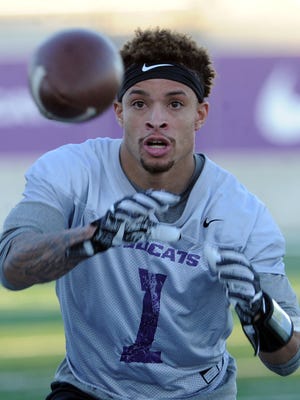 ACU receiver D.J. Fuller catches the ball during a drill on the team's first day of spring practice Thursday, March 1, 2018 at Wildcat Stadium.