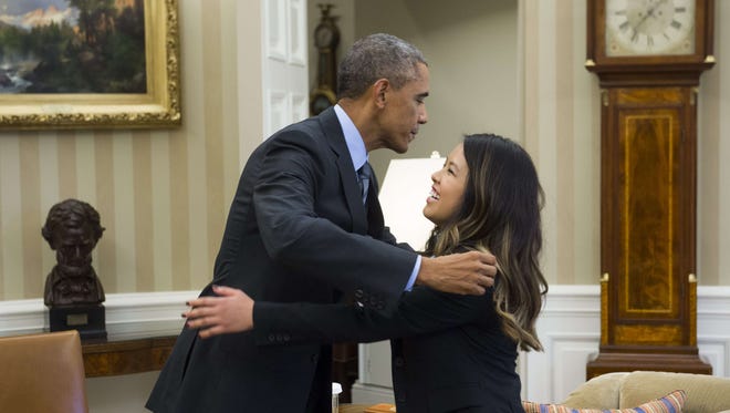 President Obama and Nina Pham.