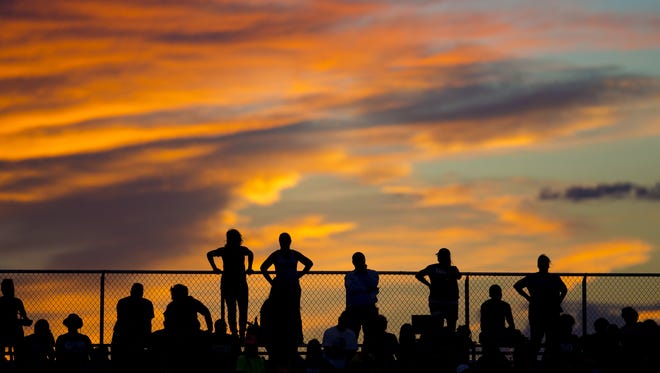 Chandler fans watch a high school football game against Red Mountain High School in Mesa on Aug. 19, 2016.