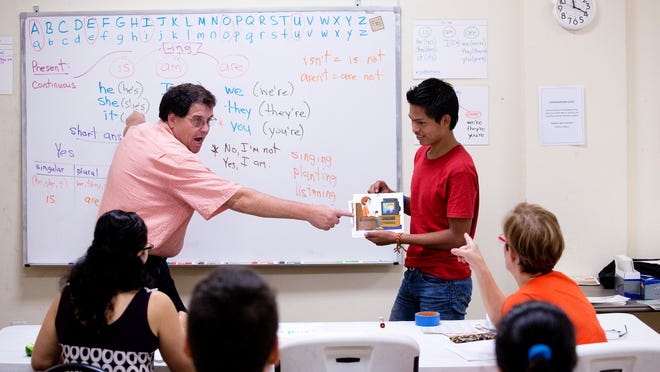 
Joe Payne, an English teacher at the Literacy Council Gulf Coast in Bonita Springs, teaches beginners, including Morfy Velasquez on Tuesday. Lee County has had the fastest growth rate of workers with limited English proficiency in the U.S. 
