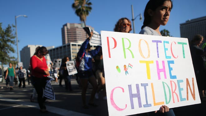 Protestors march against the separation of migrant children from their families on June 18, 2018 in Los Angeles. 