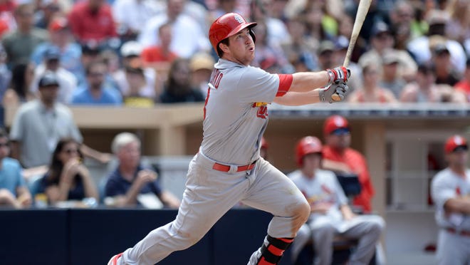 Cardinals second baseman Jedd Gyorko triples during the fourth inning against the San Diego Padres at Petco Park.