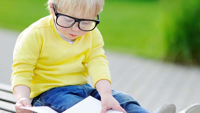 Toddler wearing hard-to-break eyeglasses specially designed for small children.