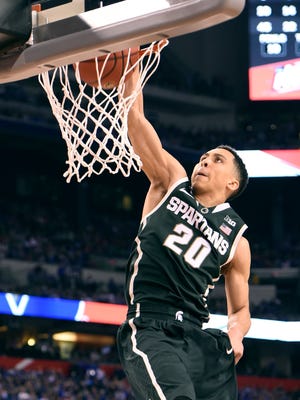 Travis Trice throws down a dunk late against Duke in the Final Four on Saturday night in Indianapolis. Trice scored 16 points in his final game with MSU.