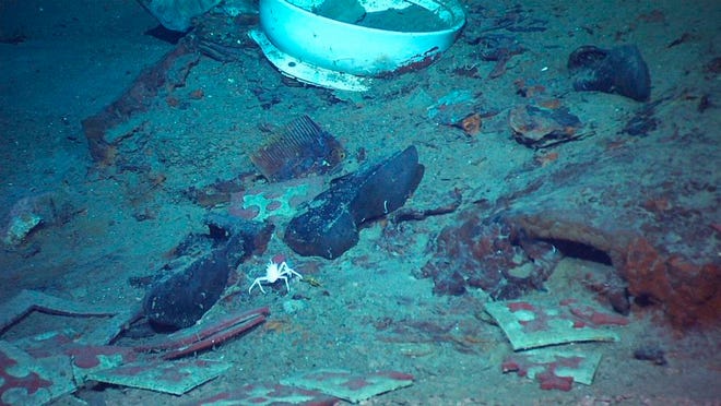 This 2004 image provided by the University of Rhode Island's Institute for Exploration and Center for Archaeological Oceanography and the National Oceanic and Atmospheric Administration's Office of Ocean Exploration shows the shoes of one of the possible victims of the Titanic disaster. A company's plan to retrieve the Titanic's radio has sparked a debate over whether the famous shipwreck still holds human remains.