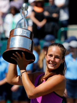 Daria Kasatkina celebrates after defeating Jelena Ostapenko during their finals match at the Volvo Open in Charleston, S.C.