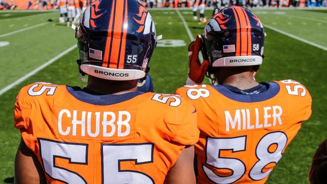 Denver Broncos linebacker Bradley Chubb (55) and linebacker Von Miller (58) look on during the first half of an NFL football game against the Oakland Raiders, Sunday, Sept. 16, 2018, in Denver. (AP Photo/Jack Dempsey)
