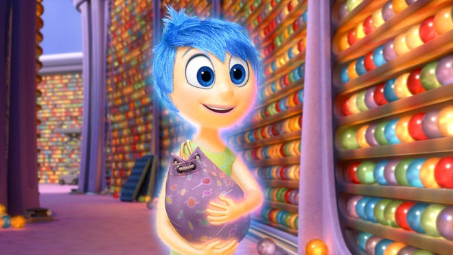 The character Joy, voiced by Amy Poehler, appears in a scene from “Inside Out.”