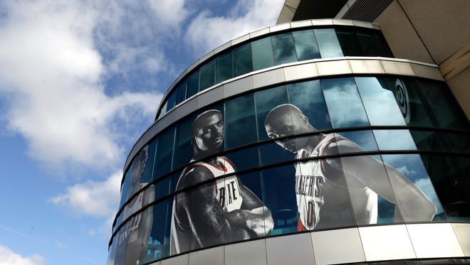 Likenesses of Portland Trail Blazers LaMarcus Aldridge, left, and Damian Lillard adorn the outside of the Moda Center arena in Portland, Ore., Wednesday, April 22, 2015.  The Trail Blazers, who play the Memphis Grizzies in Memphis tonight for Game 2 of their NBA first round playoff games, will return to the Moda Center Saturday for Game 3.