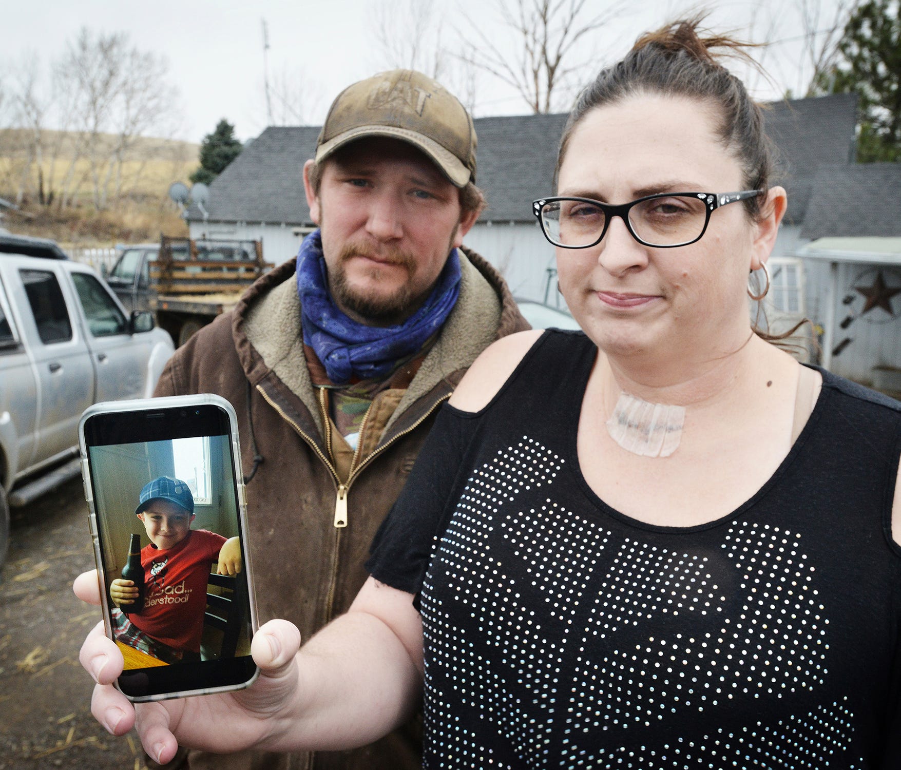 Scott Hinkle, left, and Sara Hebard, both of Pilot Rock, Oregon, lost their son, Liam Flanagan, 8, pictured in the cell phone photo, on Saturday, Jan. 21, 2018, after an eight-day battle with a flesh-eating bacteria.
