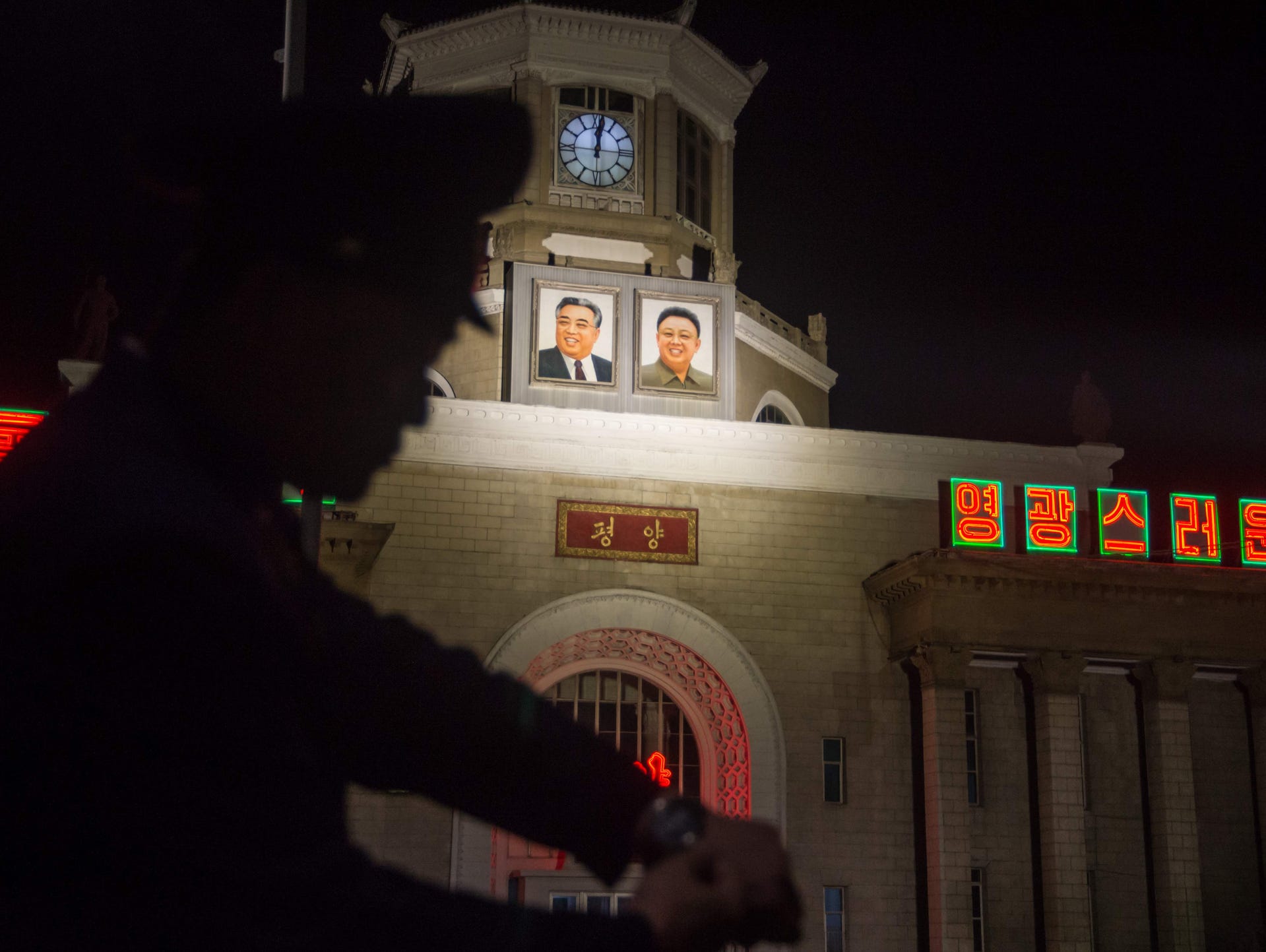 A traffic policeman checks his watch outside the central