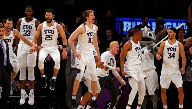 Mar 30, 2017; New York, NY, USA; TCU Horned Frogs guard Kenrich Williams (34) celebrates with teammates in the final minutes against the Georgia Tech Yellow Jackets during the second half in the championship game of the 2017 NIT Tournament at Madison Square Garden. Mandatory Credit: Adam Hunger-USA TODAY Sports