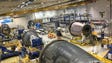 Portions of Boeing Dreamliner fuselages are worked