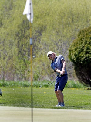 Green Bay Notre Dame senior Ethan Diestler chips a ball on the green during the Fox River Classic Conference championship on Wednesday at Wander Springs Golf Course in Greenleaf. Diestler was one of four players on the team to earn first-team all-FRCC honors.