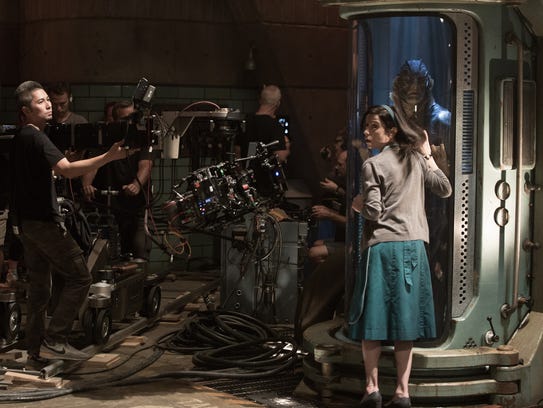 Sally Hawkins and Doug Jones (in tank) on the set of