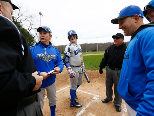 Metuchen head coach Leo Danik and team captain Michael Lapczynski review grounds rules before an April 17 game against Middlesex.