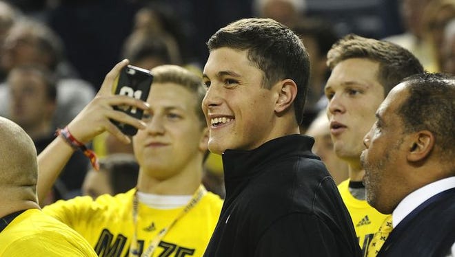 Zach Gentry watches Michigan's game against Wisconsin on Saturday night.