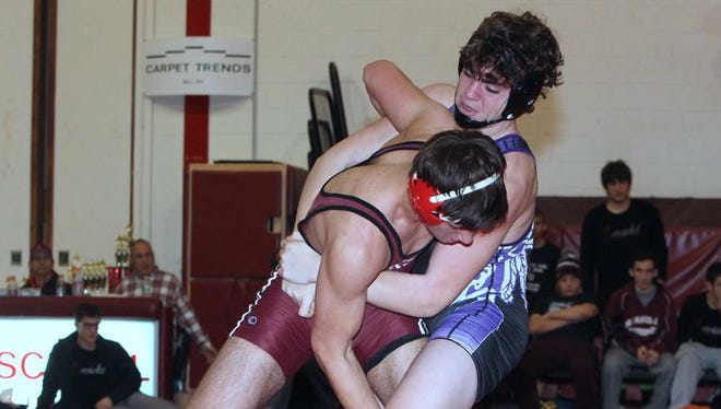John Jay's Evan Frank, right, defeated Scarsdale's Andrew Braun in the 182-pound finals match at the Rye Dual Meet Tournament Dec. 6, 2014.