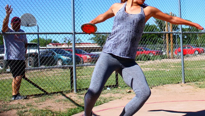 Tularosa junior Sierra Montoya works on her discus throw during practice Monday afternoon.