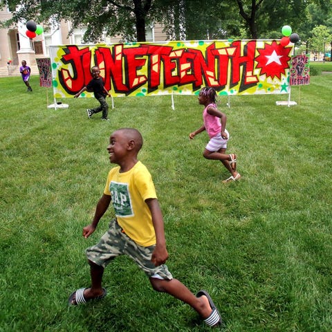 Kids have fun running around the courtsquare at a 