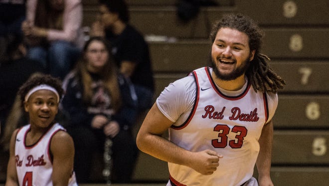 Richmond center Colton Davis smiles after the team forced an offensive turnover during the third quarter of a game against Kokomo at the Tiernan Center on Friday, Feb. 9, 2018. Richmond won the game 71-64.
