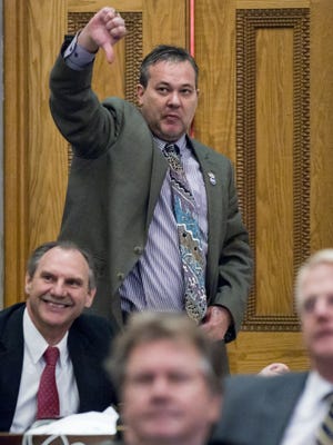 Rep. Judd Matheny, R-Tullahoma, signals his stance on a motion during a House debate in Nashville during the last day of the 2015 regular legislative session.