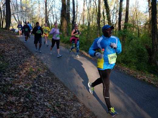 Half Marathon runner Alan Melinda of Columbia, MD.(2815) along with other runners make their way down Third Creek Greenway near mile marker 9 during the 2016 Covenant Health Knoxville Marathon on Sunday, April 3, 2016. 
