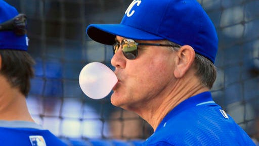 FILE - In this Sept. 28, 2016, file photo, Kansas City Royals manager Ned Yost blows a bubble before a baseball game against the Minnesota Twins at Kauffman Stadium in Kansas City, Mo. The Royals are reporting to spring training in Arizona with expectations of competing for another AL Central title after missing the postseason a year ago(AP Photo/Orlin Wagner, File)