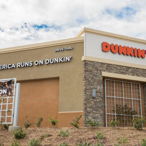A Dunkin' outlet with an "America Runs on Dunkin'"