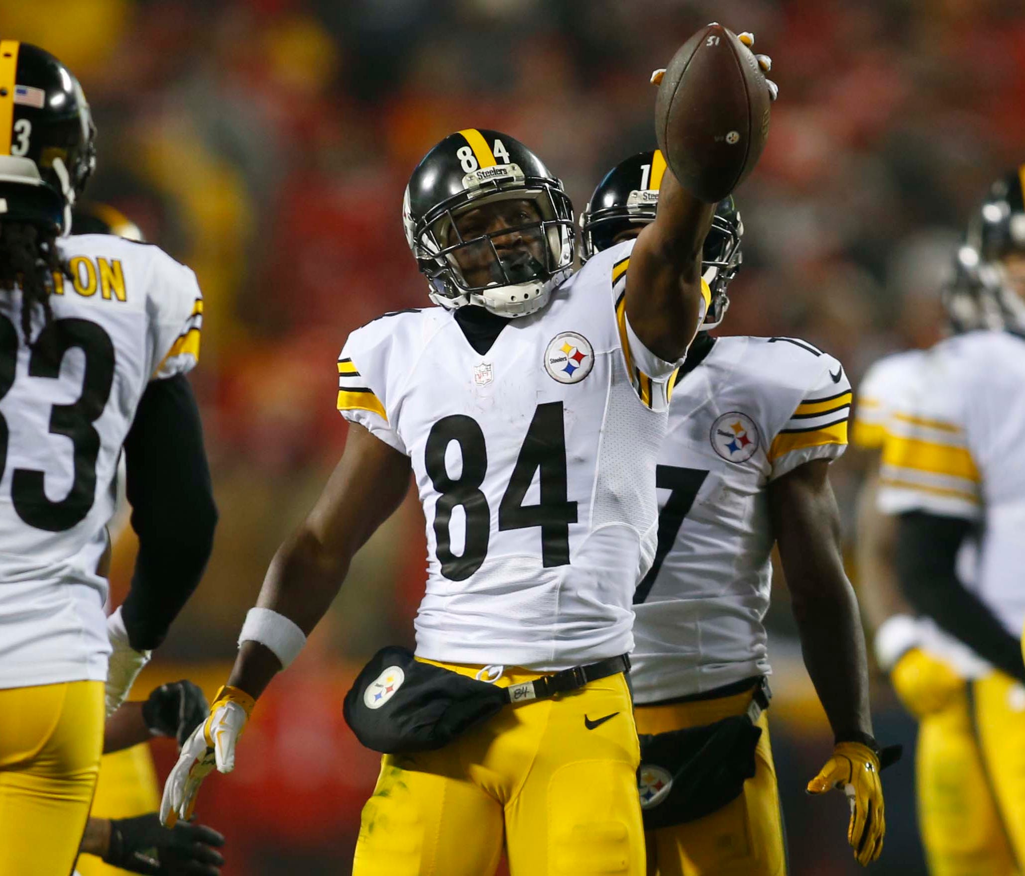 Pittsburgh Steelers wide receiver Antonio Brown (84) holds up the ball after a play during the second quarter against the Kansas City Chiefs in the AFC Divisional playoff game at Arrowhead Stadium.