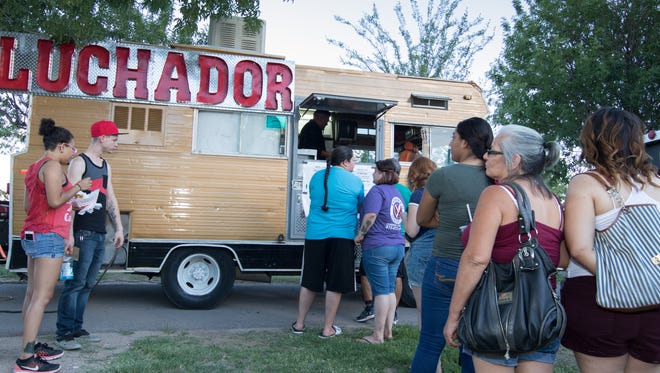 Long lines at the Luchador food truck during the  Food Truck Fiesta on July 20, 2016 at Young Park.