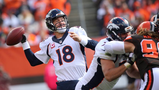 Denver Broncos quarterback Peyton Manning (18) prepare to pass during the first half of an NFL football game against the Cleveland Browns, Sunday, Oct. 18, 2015, in Cleveland. (AP Photo/Aaron Josefczyk)