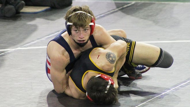 Estero's Kyle Nesbit battles Olympic Height's Ethan Altabet in the fifth-place match at the state wrestling tournament in Kissimmee in 2016. Nesbit defeated Altabet 5-3 to finish fifth in the state.