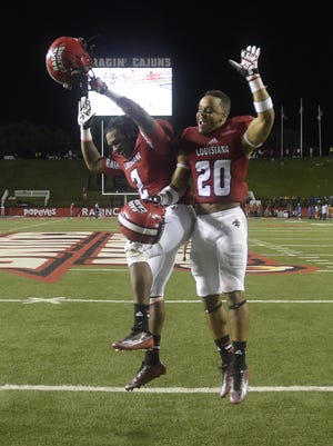 Cajuns slot receiver Al Riles (2) and defensive back Dominick Jones (20) both were winners at the UL football team's annual awards banquet.