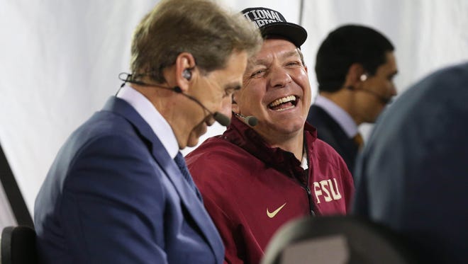 Jan 6, 2014; Pasadena, CA, USA; Florida State Seminoles head coach Jimbo Fisher shares a laugh with Alabama Crimson Tide head coach Nick Saban on the ESPN post game set after defeating the Auburn Tigers 34-31 during the second half of the 2014 BCS National Championship game at the Rose Bowl.  Mandatory Credit: Matthew Emmons-USA TODAY Sports