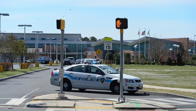 Police cars block the entrance to Bennett High School on West College Ave. on Wednesday, April 5, 2017 following an incident involving multiple students.