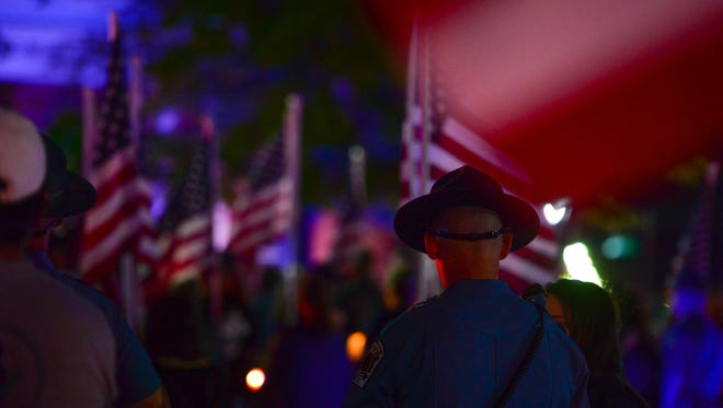 A candle vigil was held in honor of fallen Delaware State Police officer Cpl. Stephen J. Ballard at the Square in Georgetown on Monday, May 1, 2017.