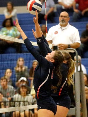 Oakland's Jessica Paden and Briley Hale-Jarrell defend the net during the match against Siegel on Tuesday.