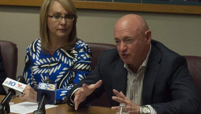 Former Rep. Gabrielle Giffords and her husband, Mark Kelly, attend a panel discussion on gun violence in Cherry Hill. Giffords was shot in Arizona while meeting with her constituents.