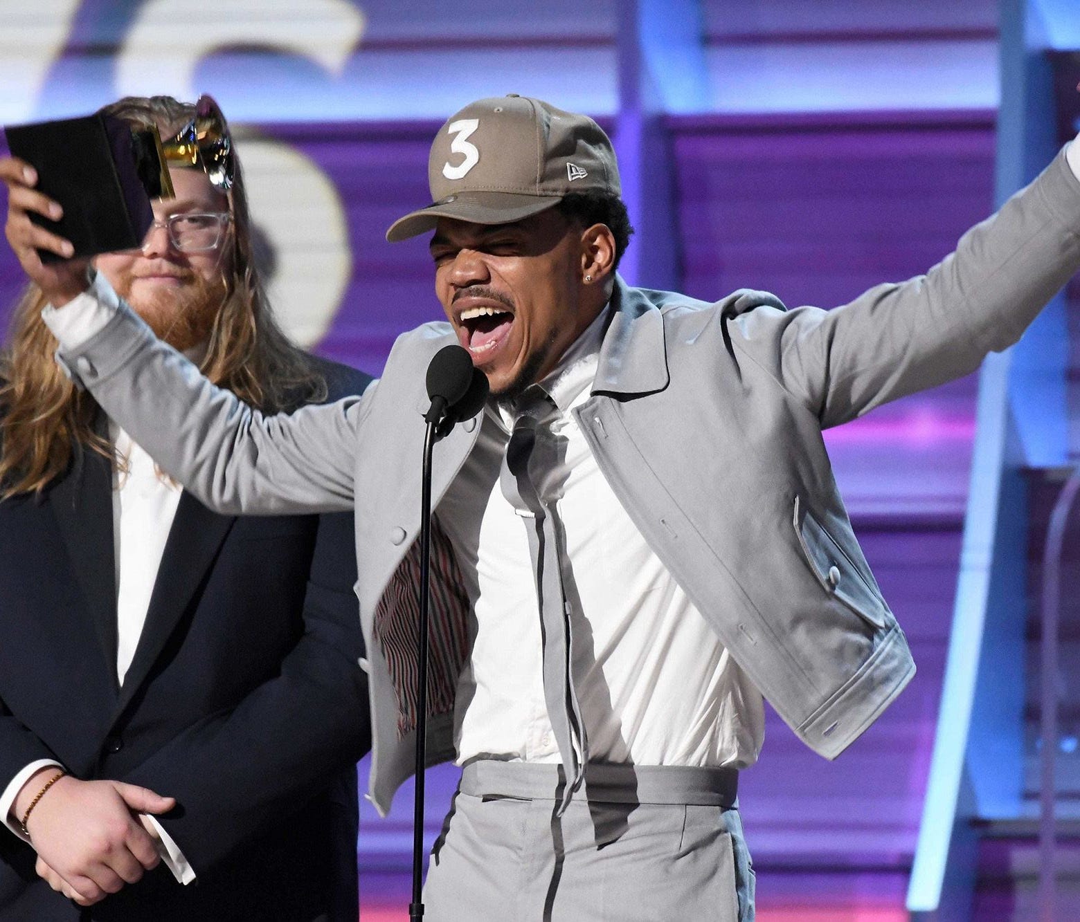 Lollapalooza announced Wednesday, March 22, 2017, that Chance the Rapper will headline the music event in Chicago in August 2017.  Here, he accepts a Grammy on Feb. 12, 2017.