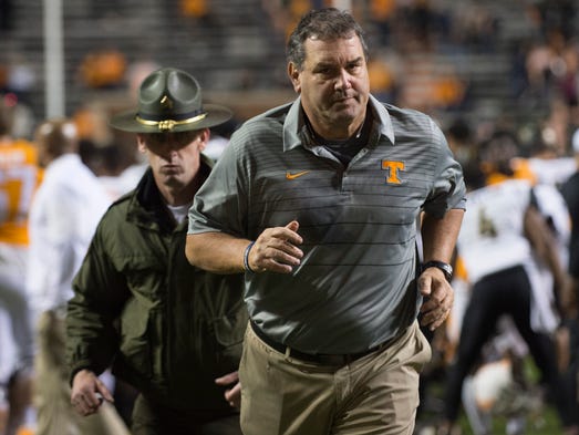 Tennessee Interim Head Coach Brady Hoke runs off the