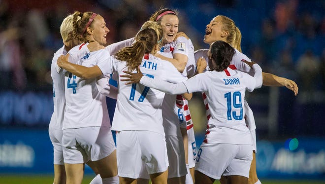 U.S. soccer players celebrate after a goal by Rose Lavelle against Canada during the 2018 CONCACAF Women's Championship final soccer match at Toyota Stadium in Frisco, Texas. 