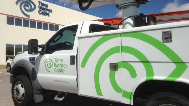 Time Warner trucks and its headquarters building in East El Paso will have new Spectrum signs and logos in coming months as Charter Communications brings in its new brand after acquiring Time Warner in May.