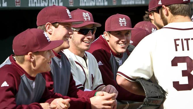 Mississippi State baseball players smile prior to a game this season.
