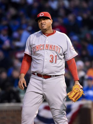 Cincinnati Reds starting pitcher Alfredo Simon (31) reacts in the first inning against the Chicago Cubs at Wrigley Field on April 13.