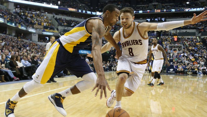 Indiana Pacers guard George Hill (3) drives to the basket  against Cleveland Cavaliers guard Matthew Dellavedova (8) at Bankers Life Fieldhouse. Indiana defeats Cleveland 93-86.