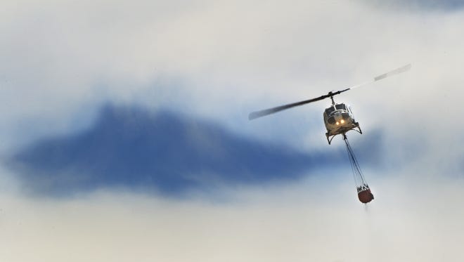Helicopters were brought in to battle a wildfire in the Sparks area on Sunday afternoon, July 6, 2014.