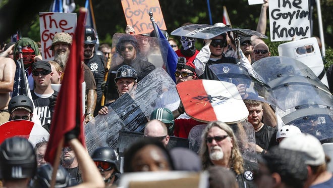 Multiple white nationalist gather on the grounds Emancipation Park, formerly known as Lee Park, during a 'Unite the Right' rally in Charlottesville, Va., on Saturday, August 12, 2017.