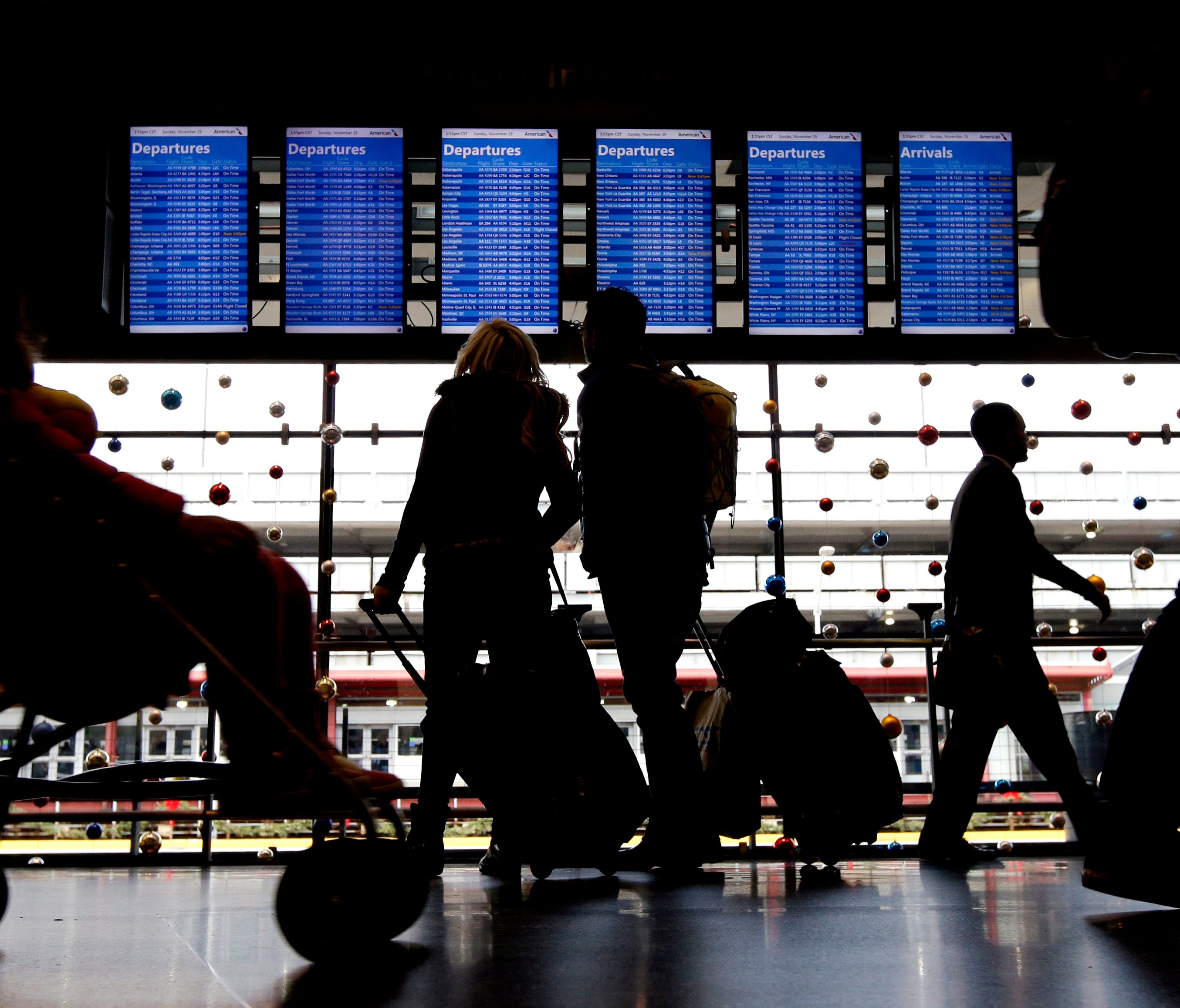 Travelers walk to their gates at Chicago O'Hare International Airport on Nov. 29, 2015.