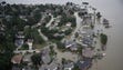 Flooded homes are shown near Lake Houston following